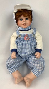 lot 138 image: World Gallery Porcelain Doll - Scooter by Holly Hunt
