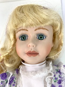 lot 160 image: Moments Treasured Porcelain Doll- Debbie