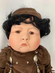 lot 197 image: CNT Design Team Porcelain Doll - Native Boy