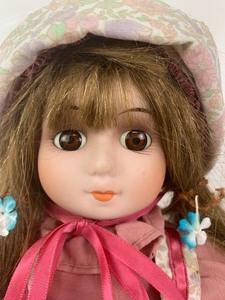 lot 212 image: Collectible Porcelain Doll with Windable Music Box Inside