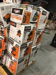 lot 12 image: Pallet of assorted Ridgid Vacuums different sizes some may need repair or have missing pieces see all pictures