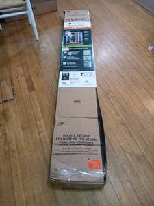 lot 14 image: 36 in. x 80 in. LuminAire White Retractable Screen Door by Andersen - not used - see pictures