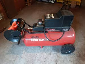 lot 13 image: Sears Craftsman 4 HP 25 Gallon Air Compressor With Hose Reel
