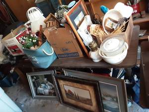 lot 82 image: Table Full Of Home Decor Includes Table & All Underneath, Framed Prints, Household & Clothing