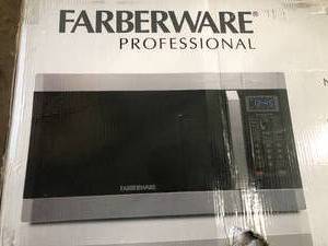 lot 19 image: 1.6 cu. Ft. 1100- Watt Countertop Microwave Oven with Smart Sensor in Stainless Steel with Platinum by Farberware- open box not used - not tested - see pictures