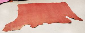 lot 29 image: Half Cow Hide Redwood Football In Color