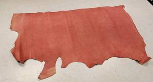 lot 42 image: Half Cow Hide Redwood Football In Color