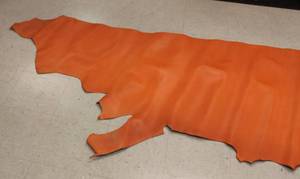 lot 61 image: Half Cow Hide Orange In Color
