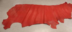 lot 63 image: Half Cow Hide Red In Color