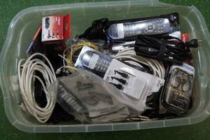 lot 93 image: Bin of Remotes and Wires - Large Assortment
