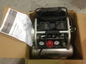 lot 71 image: 1 Gal. Portable Electric-Powered Silent Air Compressor by Husky Customer Return See pictures