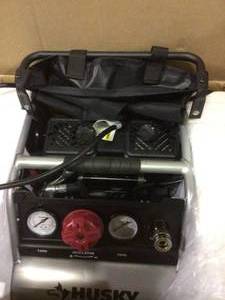 lot 53 image: 1 Gal. Portable Electric-Powered Silent Air Compressor by Husky &nbspCustomer Returns See Pictures