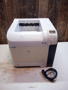 lot 1 image: HP LaserJet P4015 unit and power cord