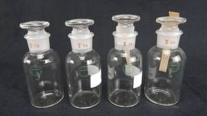 lot 38 image: Set of 4 Vintage Mercer Glass Works Merco 40 ML Narrow Mouth Pyrex Glass Bottles With Stoppers