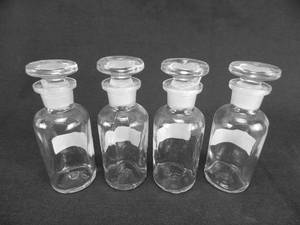 lot 42 image: Set of 4 Vintage Wheaton Glass Company 40 ML Narrow Mouth Glass Bottles With Stoppers