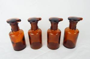 lot 137 image: Set of 4 Vintage T.C.W. Company 60 ML Amber Glass Dropping Bottles With Stoppers