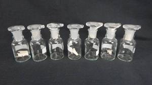 lot 145 image: Set of 7 Vintage T.C.W. Company 30 ML Glass Dropping Bottles With Stoppers