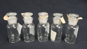 lot 171 image: Set of 5 Vintage T.C.W. Company 30 ML Wide Mouth Glass Bottles With Stoppers