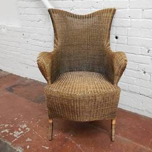 lot 36 image: Handsome Batwing Wicker Armchair