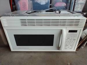 lot 68 image: Amana Over Range Microwave