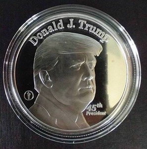 lot 14 image: Donald Trump 1 Oz Silver Round