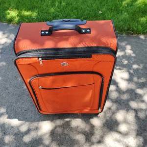 lot 283 image: American Tourist Orange Suitcase