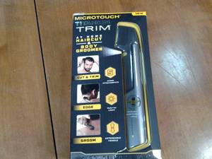 lot 86 image: Micro touch titanium trim at home h...