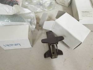 box of pipe fittings, staple puller...