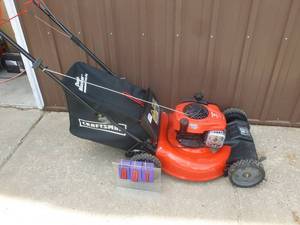 Craftsman self propelled lawn mower with bag. Nearly new. Tested & works. As shown.
