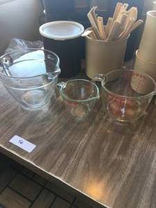 lot 56 image: Large Lot of Plastic Serving Containers, Glass Measuring Bowls, Ladles and More