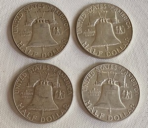 Four 1962 Benjamin Franklin Half Dollar Coins