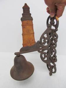 lot 23 image: Cast Metal Dinner Bell w Lighthouse Design