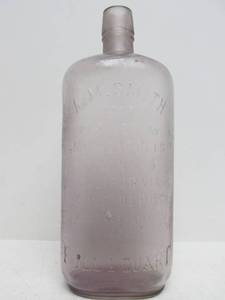 lot 34 image: Antique A.M. SMITH Minneapolis Wine Depot Liquor Store AmethystPurple Embossed Glass Bottle
