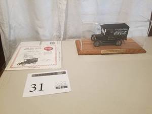 lot 31 image: 124 Scale 1925 Ford Model T Panel Delivery Truck Die-cast Metal Replica Model by Danbury Mint