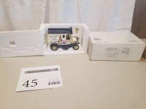 lot 45 image: Delivery Truck Die-cast Metal Coin Bank (in original packaging)