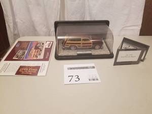 lot 73 image: 124 Scale 1949 Ford Woody Wagin Die-cast Metal Replica Model by Franklin Mint
