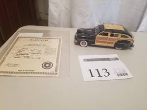 lot 113 image: 124 Scale 1942 Chrysler Town & Country Station Wagon Die-cast Metal Replica Model by Danbury Mint