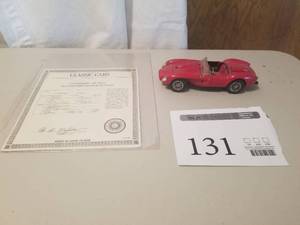 lot 131 image: 124 Scale 1958 Ferrari 250 Testa Rosa Roadster Die-cast Metal Replica Model by Danbury Mint