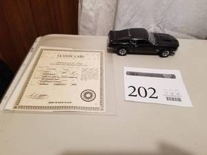 lot 202 image: 124 Scale 1969 Ford Mustang Boss 429 Fastback Die-cast Metal Replica Model by Danbury Mint