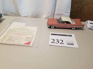 lot 232 image: 124 Scale 1957 Chrysler New Yorker Sport Coupe Die-cast Metal Replica Model by Danbury Mint
