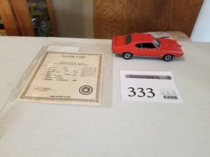 lot 333 image: 124 Scale 1969 Pontiac GTO Judge Coupe Die-cast Metal Replica Model by Danbury Mint