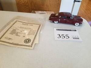 lot 355 image: 124 Scale 1948 Tucker Prototype Tin Goose Sedan Die-cast Metal Replica Model by Danbury Mint