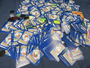 POKEMON CARDS WITH ASSORTED POGS