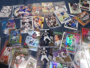 50 PLUS FOOTBALL CARDS IN PLASTIC SLEEVES