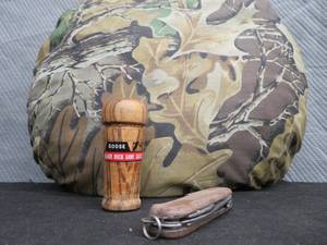 CAMO PILLOW, BLACK DUCK GOOSE CALL, POCKET KNIFE.