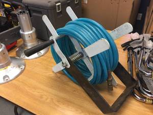 lot 98 image: Air Hose & Hose Reel w Wall Bracket