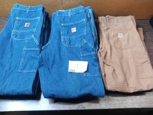 lot 42 image: 14 Pairs Of Carhartt Jeans - 4 Khaki 36x34 Carpenter Jeans, 8 Denim 36x34 Carpenter Jeans, 2 36x34 Relaxed Fit Jeans