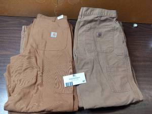 lot 67 image: 9 Pairs of Jeans (7) 32x32 Khaki Carhartt Carpenter Jeans, (2) 34x34 Khaki Carhartt Carpenter Jeans New With Tags