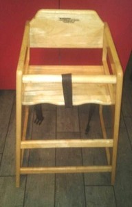 lot 24 image: Wood Booster Chair.