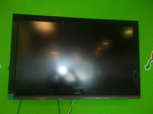 lot 30 image: 55 in. Toshiba Flat Screen TV with wall Mount and Remote.